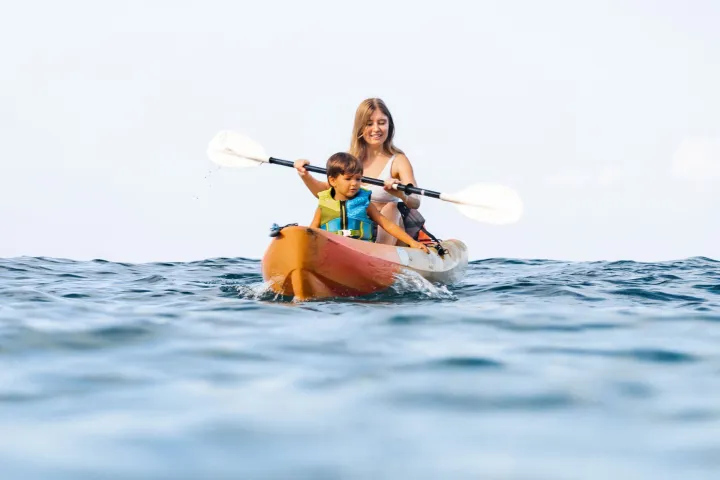 a man riding a wave on a surfboard in the water