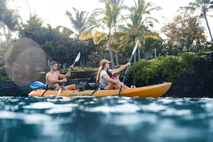 a person riding on the back of a boat