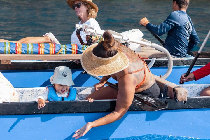 a group of people in a pool of water
