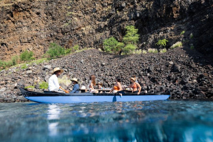 a group of people swimming in a body of water